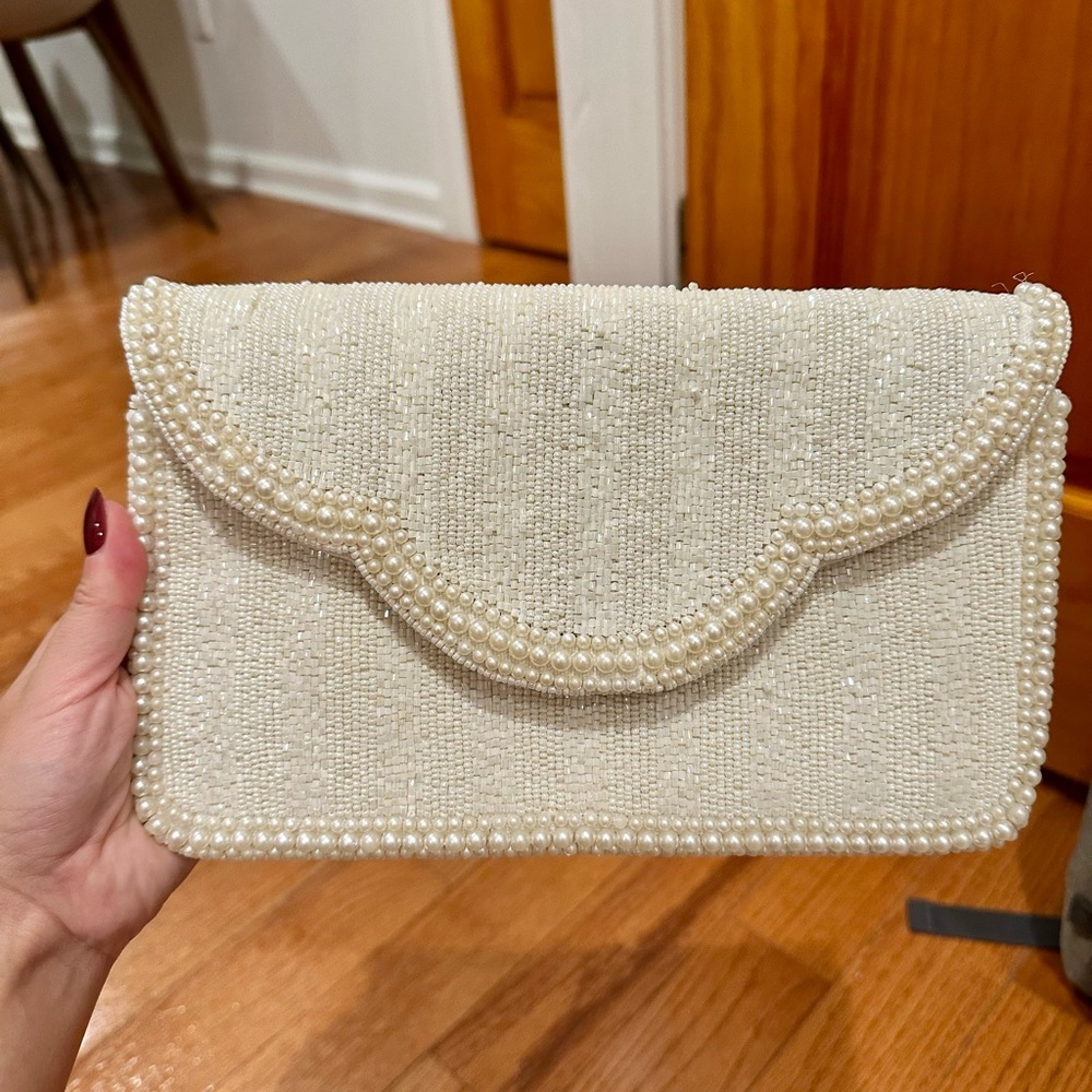 Pearl-Trim Cream Clutch Wristlet